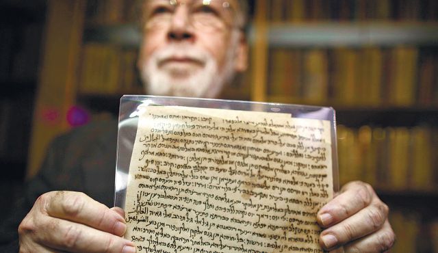 Professor Haggai Ben-Shammai displaying one of the Afghan Genizah documents.