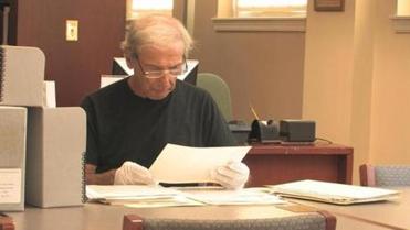 Walter M. Newman doing research at the American Jewish Historical Society office in Boston on the Dewey Stone project.