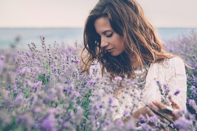 Woman smelling flowers